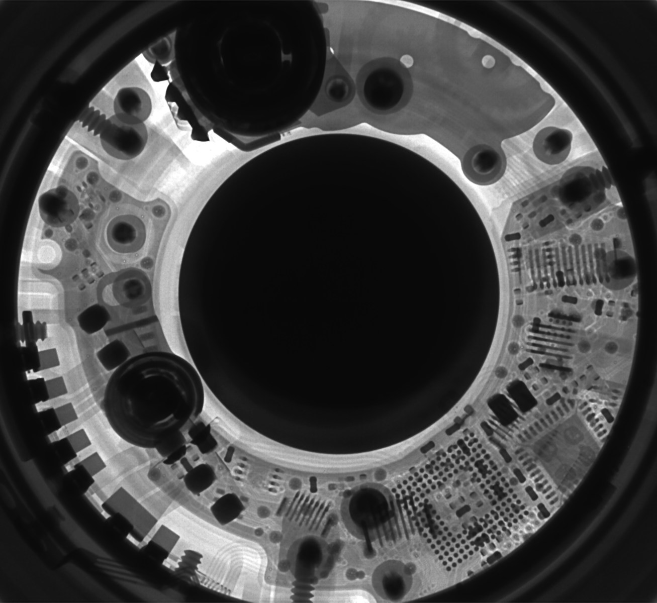 Photo by Mathew Schwartz a black and white photo of a circular object